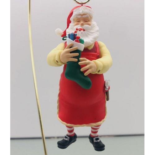 2023 Toymaker Santa Surprise - Mystery Ornament - <B>Red Apron with Green Stocking - Very Rare</B>